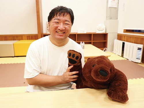 顔画像：スタッフの佐藤さん